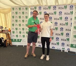 Lucas collecting his prize